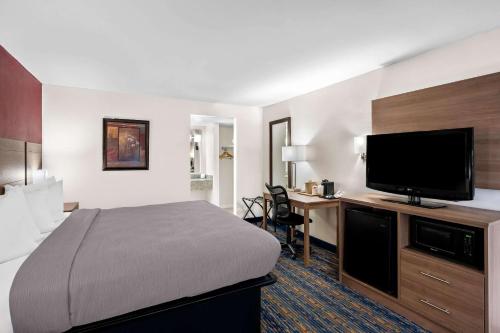 Ένα ή περισσότερα κρεβάτια σε δωμάτιο στο Quality Inn