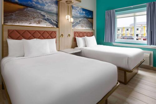 The Vibes Hotel, Trademark Collection by Wyndhamにあるベッド