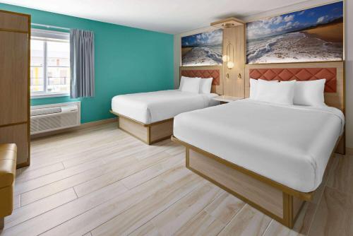 The Vibes Hotel, Trademark Collection by Wyndhamにあるベッド