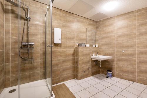 a bathroom with a shower and a sink at Relax Backnang Apartment in Backnang