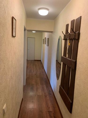 a long hallway with a mirror on the wall at K84, Nice 2- bedroom apartment - 2 big beds 1 single bed in Tartu