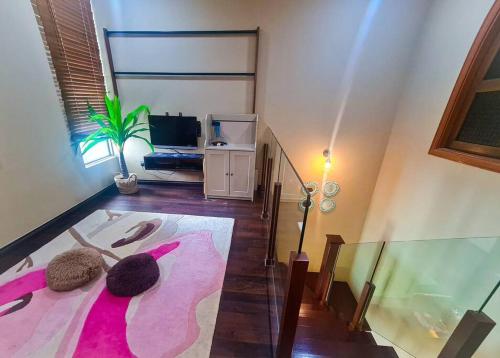 a living room with a bed and a window at Premium Vintage Home 2 Master Bedrooms 2 to 4 Pax Comfy Stay for Friends and Family in Cyberjaya