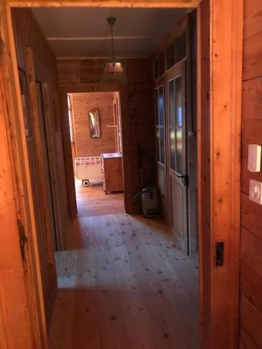 an empty hallway in a house with a room at Chalet de La Tour Mayens de Sion 4 Vallées in Agettes