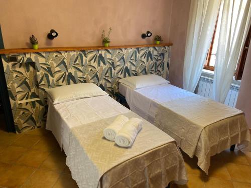 Postel nebo postele na pokoji v ubytování B&B Popoli Terme