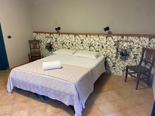 Postel nebo postele na pokoji v ubytování B&B Popoli Terme