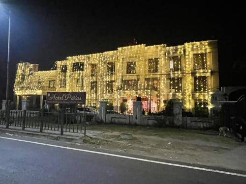 a lit up building with christmas lights on it at Hotel Paras in Dera Bassi