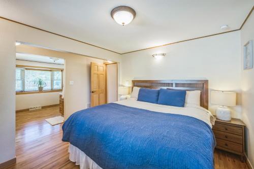 a bedroom with a large bed with blue pillows at Bright & Cozy House Centennial Littleton 3 Bed 3 Bath in Centennial