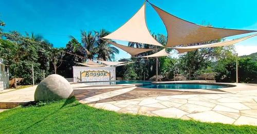 a pool with a sculpture of a paper sail at Baggak Hotel & Restaurant by SMS Hospitality in Sanchez-Mira