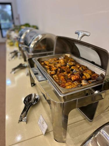 a buffet with a tray of food on a counter at Nafta Sanatorium in Naftalan