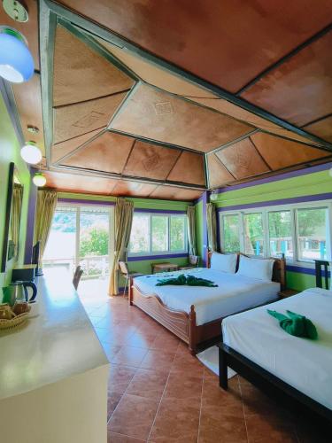 a bedroom with two beds in a room at Phi Phi View Point Resort in Phi Phi Don
