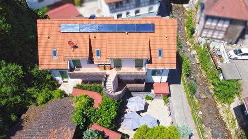 an overhead view of a house with an orange roof at SCHUSTERjunge Aparthotel in Sasbachwalden