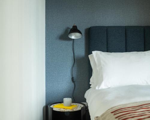 Cama o camas de una habitación en Vertus Edit Canary Wharf