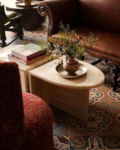 a table with a vase with a plant on it at Graduate by Hilton Palo Alto in Palo Alto