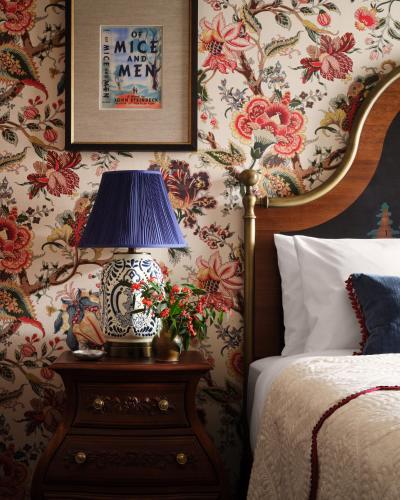 a bedroom with a bed and a lamp on a night stand at Graduate by Hilton Palo Alto in Palo Alto