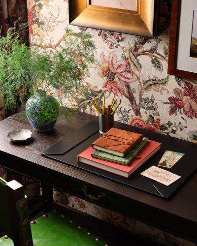 two books are sitting on a black table at Graduate by Hilton Palo Alto in Palo Alto