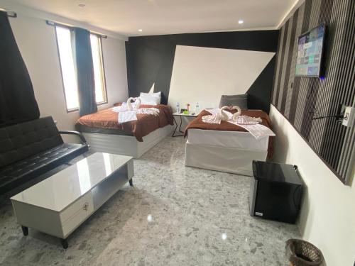 Ένα ή περισσότερα κρεβάτια σε δωμάτιο στο ME Hotel