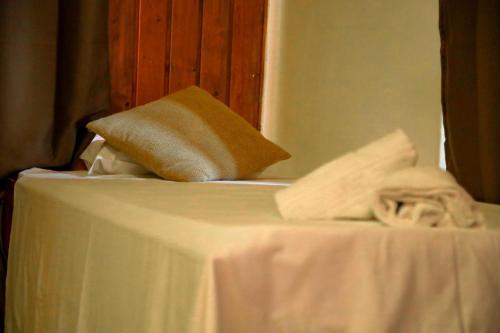 a white table with a towel on top of it at The Courtyard Retreat in Brunate