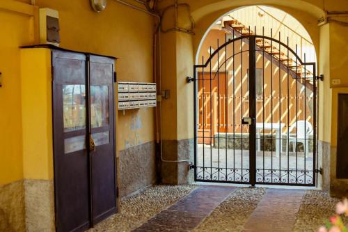 an entrance to a building with an iron gate at The Courtyard Retreat in Brunate