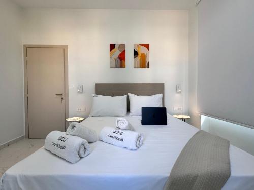 Ένα ή περισσότερα κρεβάτια σε δωμάτιο στο Casa di equità