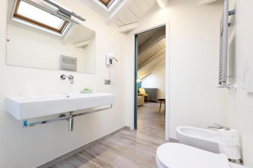 a bathroom with a sink and a toilet at Palazzo Belli in Alba
