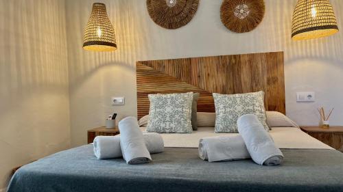 a bedroom with a bed with pillows on it at Zahora Beach Room in Zahora