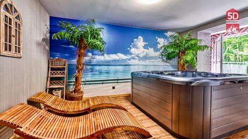 a bathroom with a bath tub with a palm tree mural at Apartament SPA 56 Resort Kozubnik blisko Szczyrk - 5D Apartamenty in Porąbka