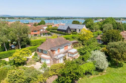 an aerial view of a large house with trees at Oldfield Cottage within walking distance of pub and sea in West Itchenor