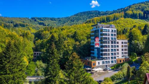 an aerial view of a hotel in the mountains at Apartament SPA 56 Resort Kozubnik blisko Szczyrk - 5D Apartamenty in Porąbka