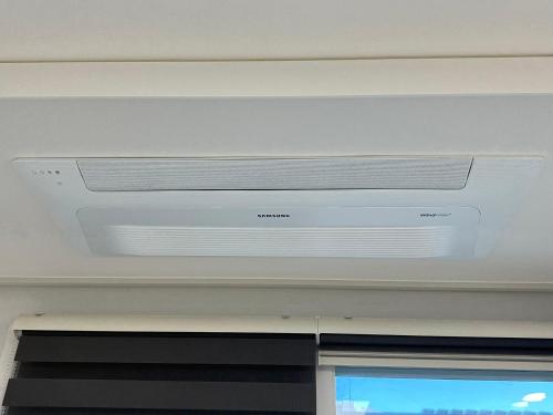 a ceiling with a air conditioner in a room at The Time hotel Incheon Airport in Incheon