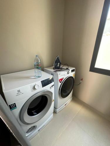 a washing machine and a washer in a room at Villa Aura 4 bd in Bang Tao Phuket in Phuket Town