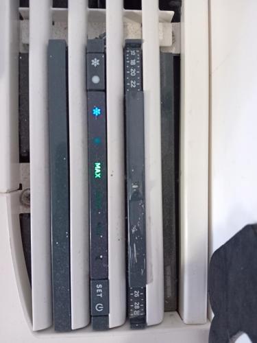 a row of remote controls sitting on a shelf at Pomezia centro in Pomezia