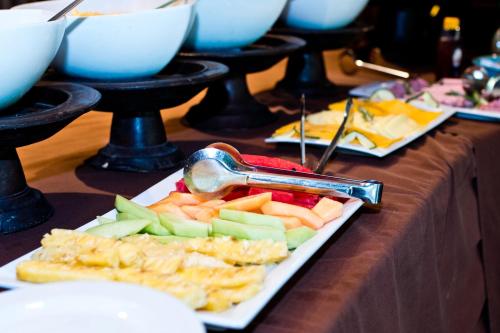 a table topped with plates of food on a table at Ubizane Zululand Safari Lodge in Hluhluwe