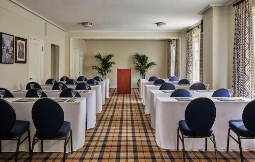 a row of tables and chairs in a room at Graduate by Hilton Berkeley in Berkeley