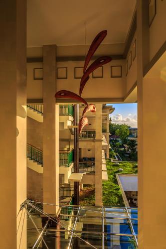 a view of a building from a window at Savoy Seychelles Resort & Spa in Beau Vallon