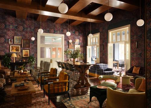 a living room with a table and chairs at Graduate by Hilton Berkeley in Berkeley