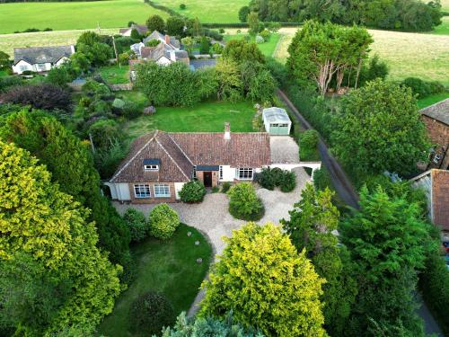 an aerial view of a house with a yard at Barton Lodge in Minehead