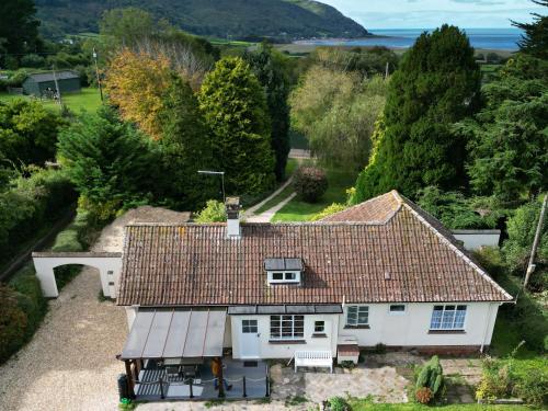 an aerial view of a house with a roof at Barton Lodge in Minehead