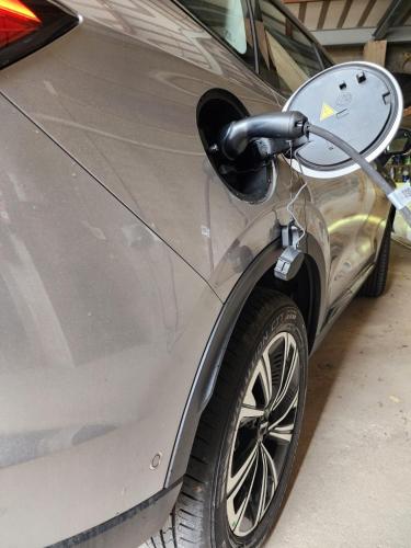 a silver car is parked in a garage at Pousada Coqueiral in Aracruz