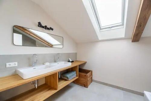 a bathroom with a sink and a mirror at Luxus Villa mit großem Pool Alleinlage Nähe Graz in Erbersdorf