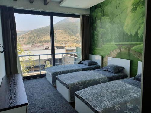 Ένα ή περισσότερα κρεβάτια σε δωμάτιο στο RIXOS Villa