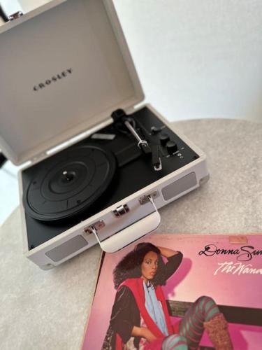 a dvd player in a box with a picture of a woman at Entire Glamping Campground, 8 Luxury Safari Tents in Cadiz