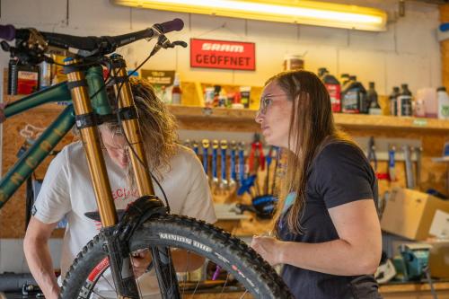 a man and a woman standing next to a bike at Harz BnB Werkmeister in Sankt Andreasberg