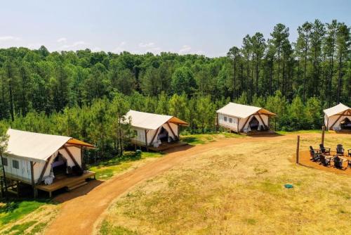 an aerial view of a group of yurt campgrounds at Entire Glamping Campground, 8 Luxury Safari Tents in Cadiz