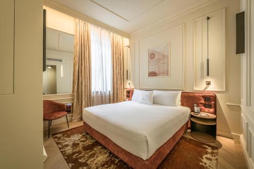 Postel nebo postele na pokoji v ubytování Palazzo Montebello