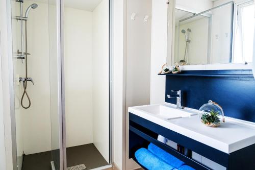 a bathroom with a sink and a shower at Atlantica Parc in Taghazout