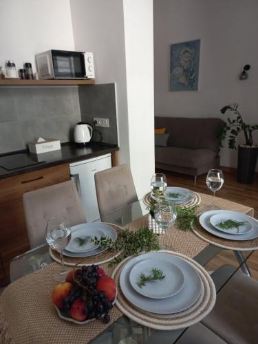 a dining room table with plates of food on it at Fiesta Apartment on Franka 2BR-6P in Lviv