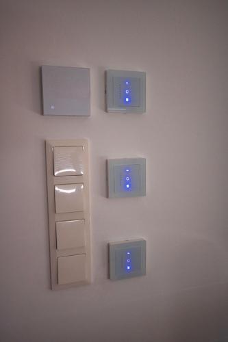 a wall with four electrical boxes on the wall at Gemütliche Wohnung im schönen Chiemgau in Traunreut