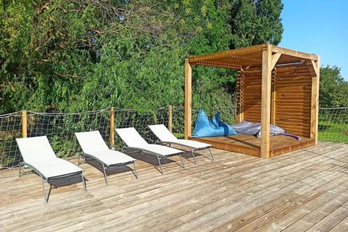 a deck with chairs and a gazebo at 84B6 - Loft in charming 18th century farmhouse in Althen-des-Paluds