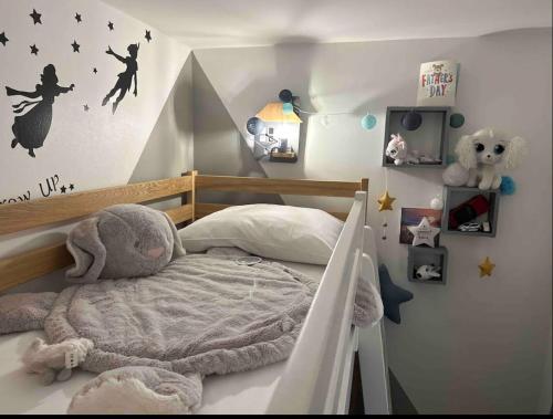 a childs bedroom with a bed with a canopy at Immodēly & la Magie de Disney in Serris