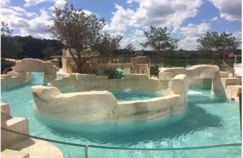 a swimming pool in a water park at Immodēly & la Magie de Disney in Serris
